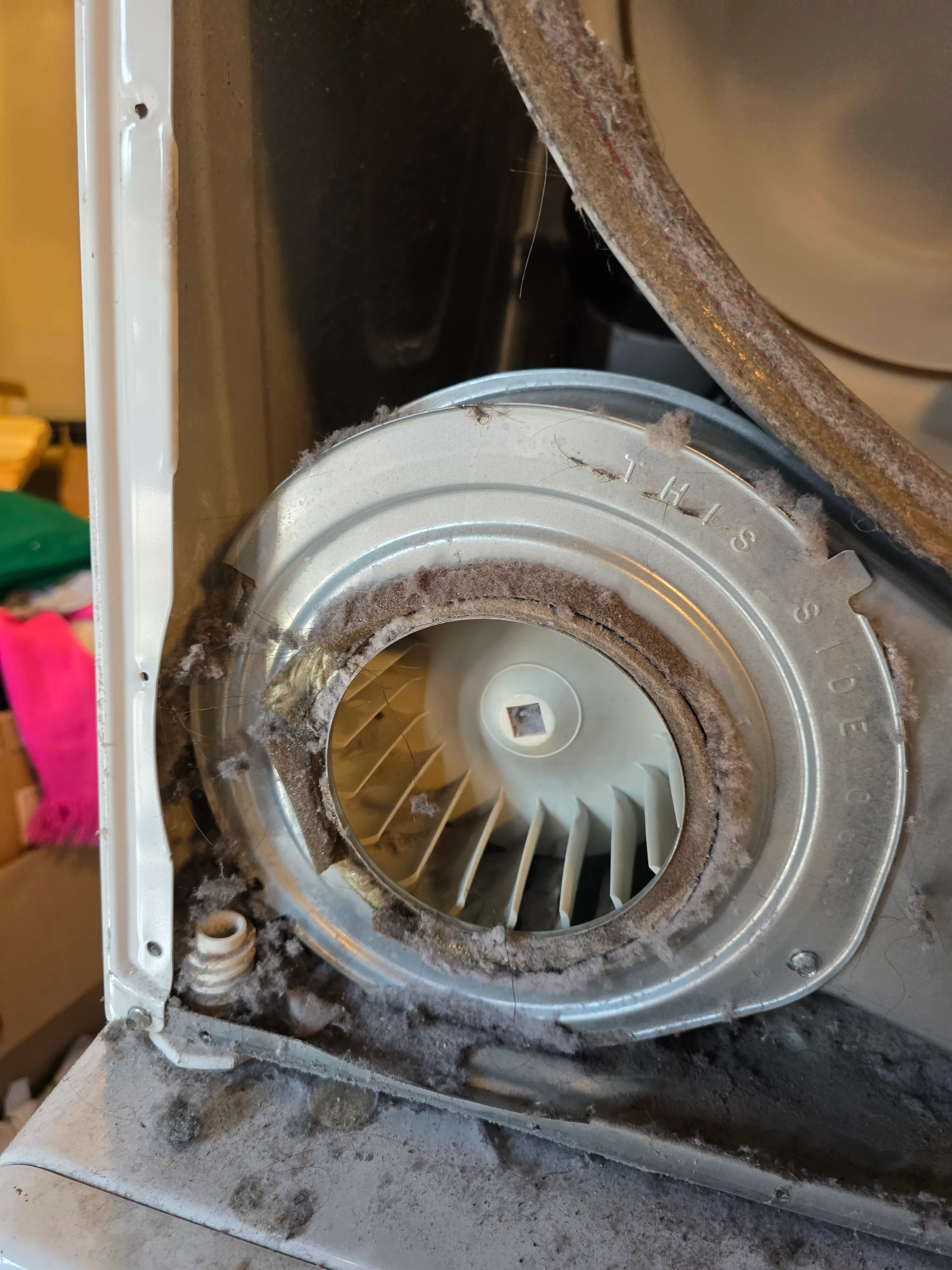 Dryer blower wheel with heavy lint buildup restricting airflow — Los Angeles service