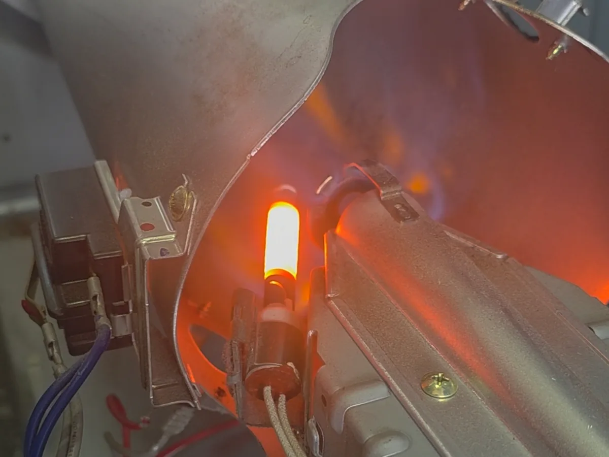 Igniter glowing at the burner of an LG dryer